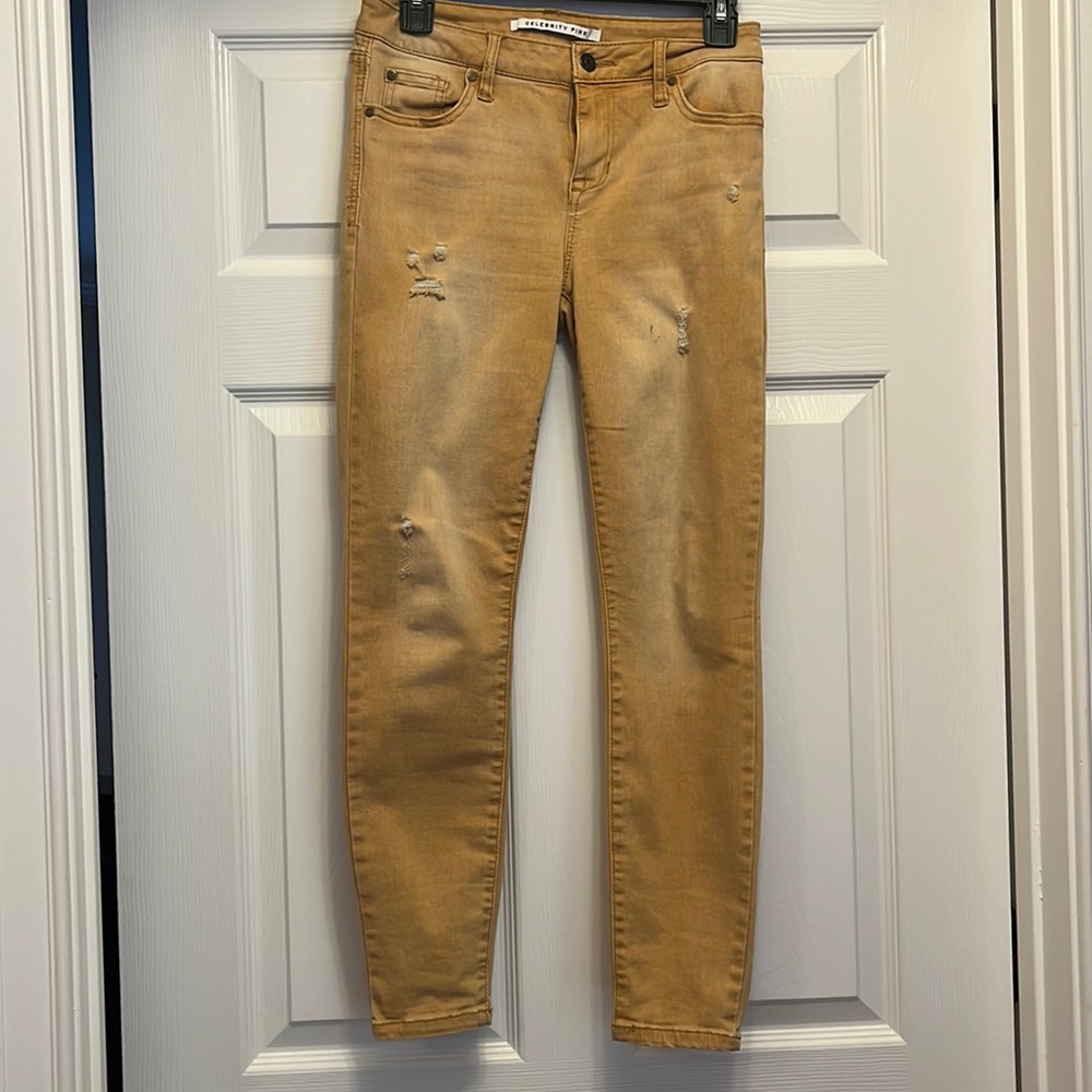 Celebrity Pink distressed gold colored jeans. Mid rise ankle skinny. Size 5/27
